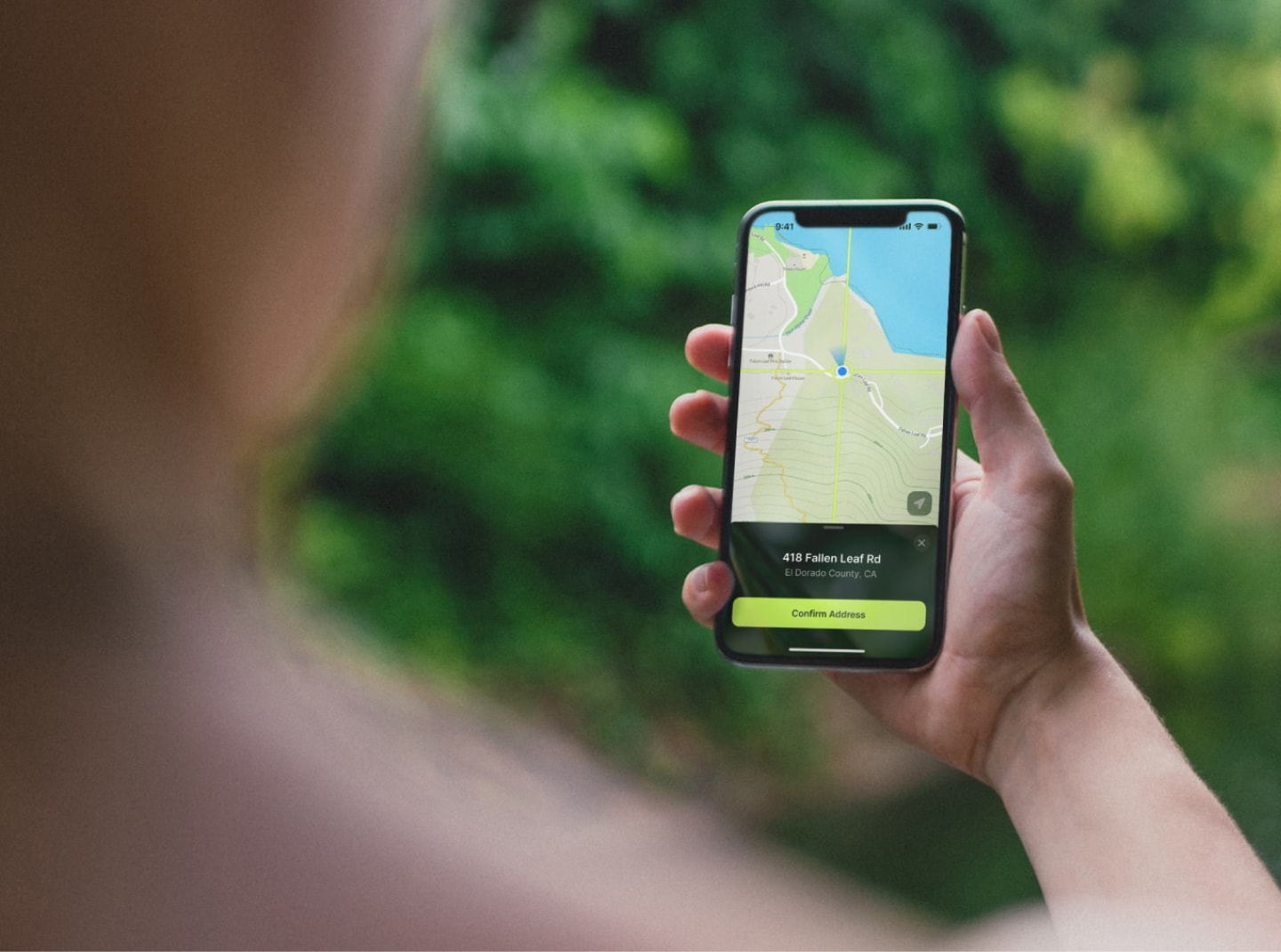 Two phones float above a spread of food
